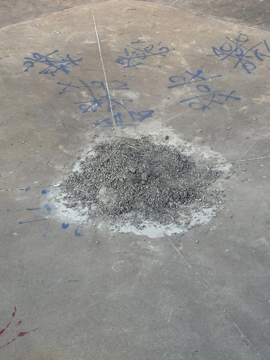 Drain covered with cement at Mat Hoffman Park